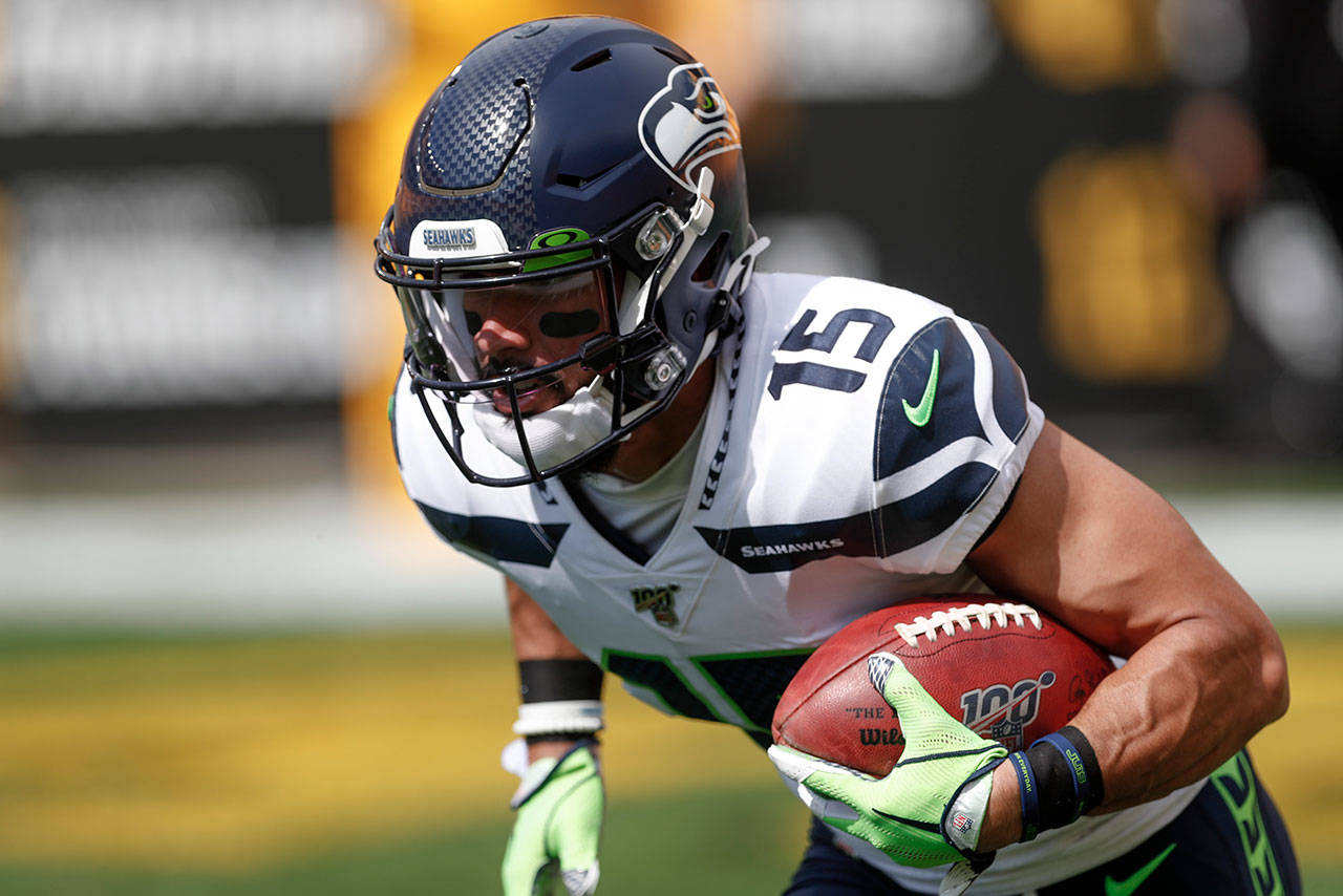 Seattle Seahawks wide receiver John Ursua walks off the field after News  Photo - Getty Images