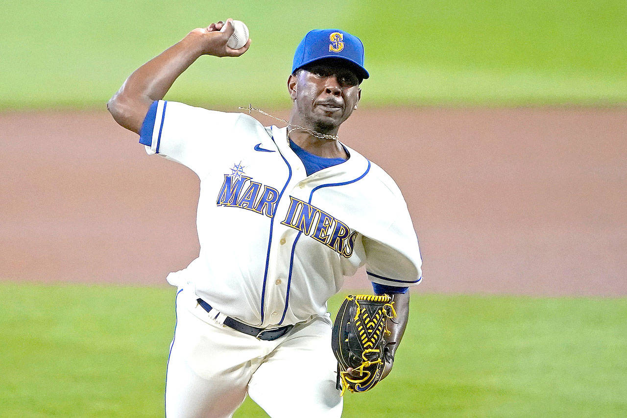 Seattle Mariners starting pitcher Justin Dunn throws against the Texas Rangers during the first inning of a baseball game Sunday, Aug. 23, 2020, in Seattle. (Ted S. Warren/Associated Press)