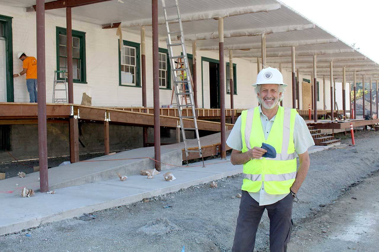 Dave Robison, the executive director of the Fort Worden Public Development Authority, will retire in November after serving as the director for the past nine years. He stands Wednesday, Sept. 9, 2020, in front of Building 305, which is in the final stages of its renovation for the Makers Square project. (Zach Jablonski/Peninsula Daily News)