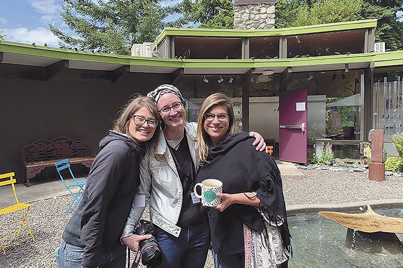 The Port Angeles Fine Arts Center staff is pictured at the 2019 Summertide Festival. From left are Lauren Bailey, community outreach coordinator; Sarah Jane, gallery and program director; and Jessica Elliott, executive director.