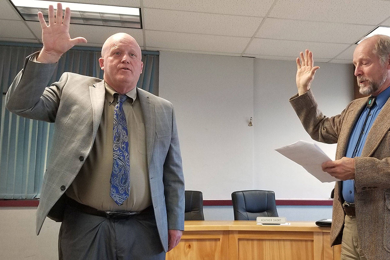 Rob Clark is officially sworn in as the interim superintendent of the Sequim School District by Judge Brian Coughenour in August 2019. Clark on leave as of Oct. 22 pending the outcome of a complaint, school district officials said this week. Sequim Gazette file photo by Conor Dowley