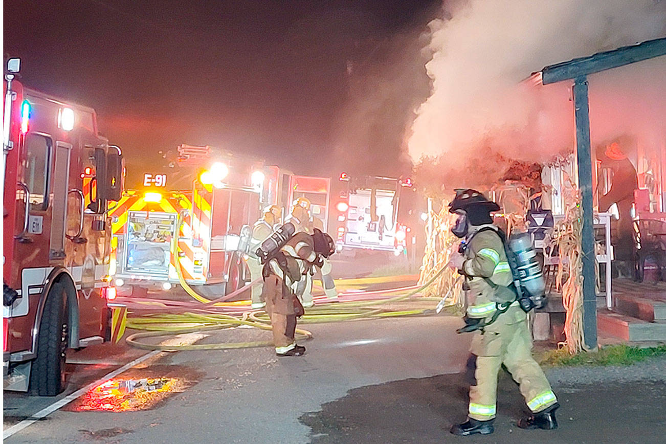 Smoke billows from the Nordland General Store as firefighters respond to a fire inside the building in the early morning hours Thursday. The building also houses a U.S. Post Office with about 215 Post Office boxes. Courtesy Leah Speser