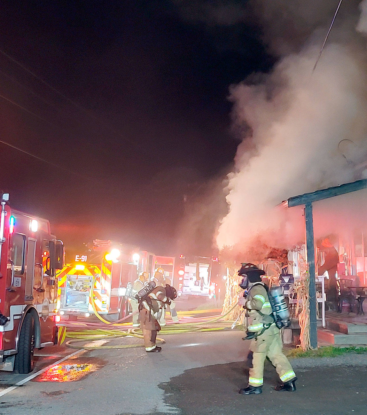 Smoke billows from the Nordland General Store as firefighters respond to a fire inside the building in the early morning hours Thursday, Nov. 5, 2020. The building also houses a U.S. Post Office with about 215 Post Office boxes. (Photo courtesy of Leah Speser)