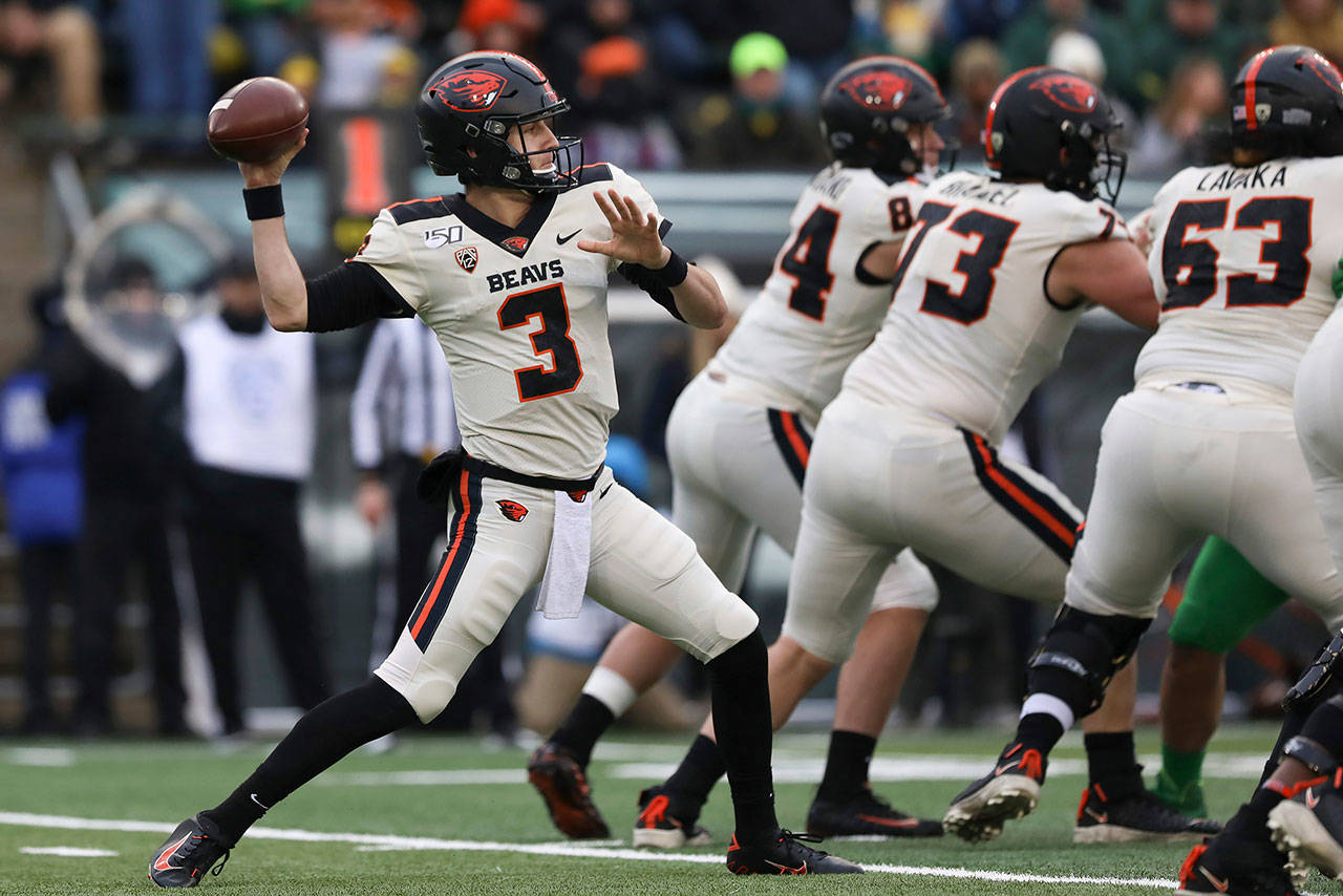 In this Nov. 30, 2019, file photo, Oregon State quarterback Tristan Gebbia (3) throws a pass during the second half of an NCAA college football game against Oregon in Eugene, Ore. The uncertainty for the Beavers is centered on the offense. Quarterback Jake Luton has moved on to the Jacksonville Jaguars and Gebbia, at least for now, looks like the frontrunner going into the abbreviated season. (Amanda Loman/Associated Press file)