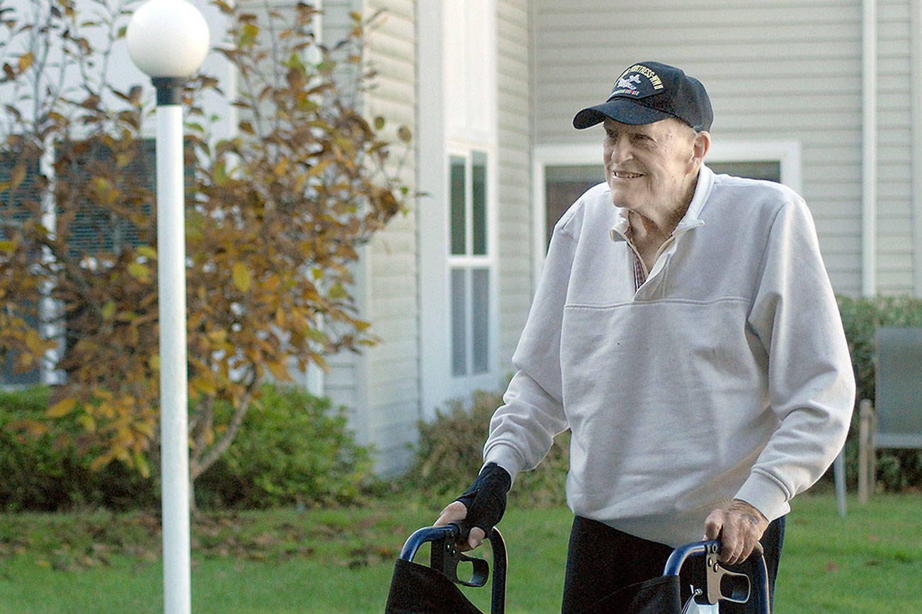 Keith Thorpe/Peninsula Daily News
Larry Owen, 97, stands outside the St. Andrew's Place Assisted Living Community in Port Angeles on Friday.