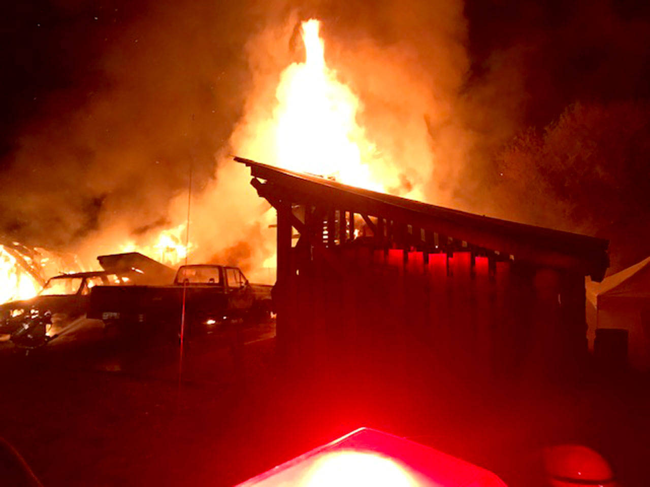 A structure fire burns on Oxenford Road in Joyce just after midnight Sunday, Nov. 8, 2020. (Courtesy photo)