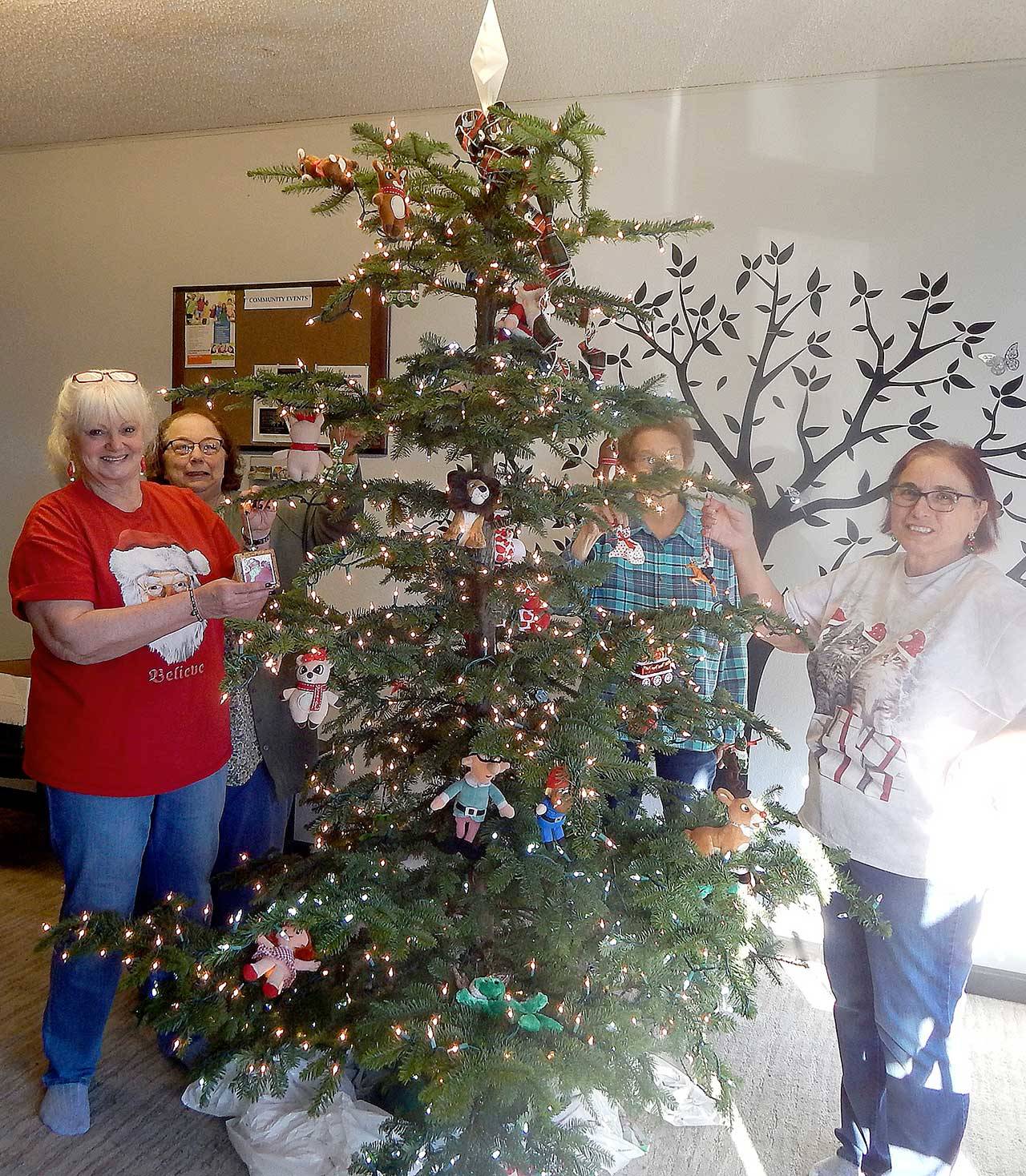 Farmers Insurance will host the Soroptimist’s Raffle Tree in addition to one it will sponsor. Decorators, from left, are Pam Nelson, Punky Goakey, Janet Marion and Sharla Fraker.