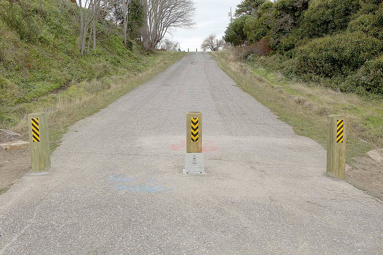 Port Townsend Public Works installed permanent wooden bollards that have replaced the “road closed” signage on Adams Street after the city council voted to keep the street closed. (Zach Jablonski/Peninsula Daily News)