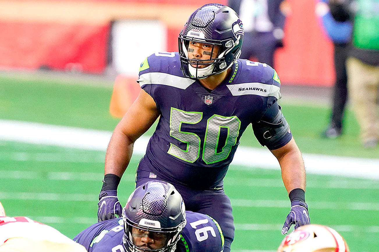 Seattle Seahawks linebacker K.J. Wright walks on the field Tuesday