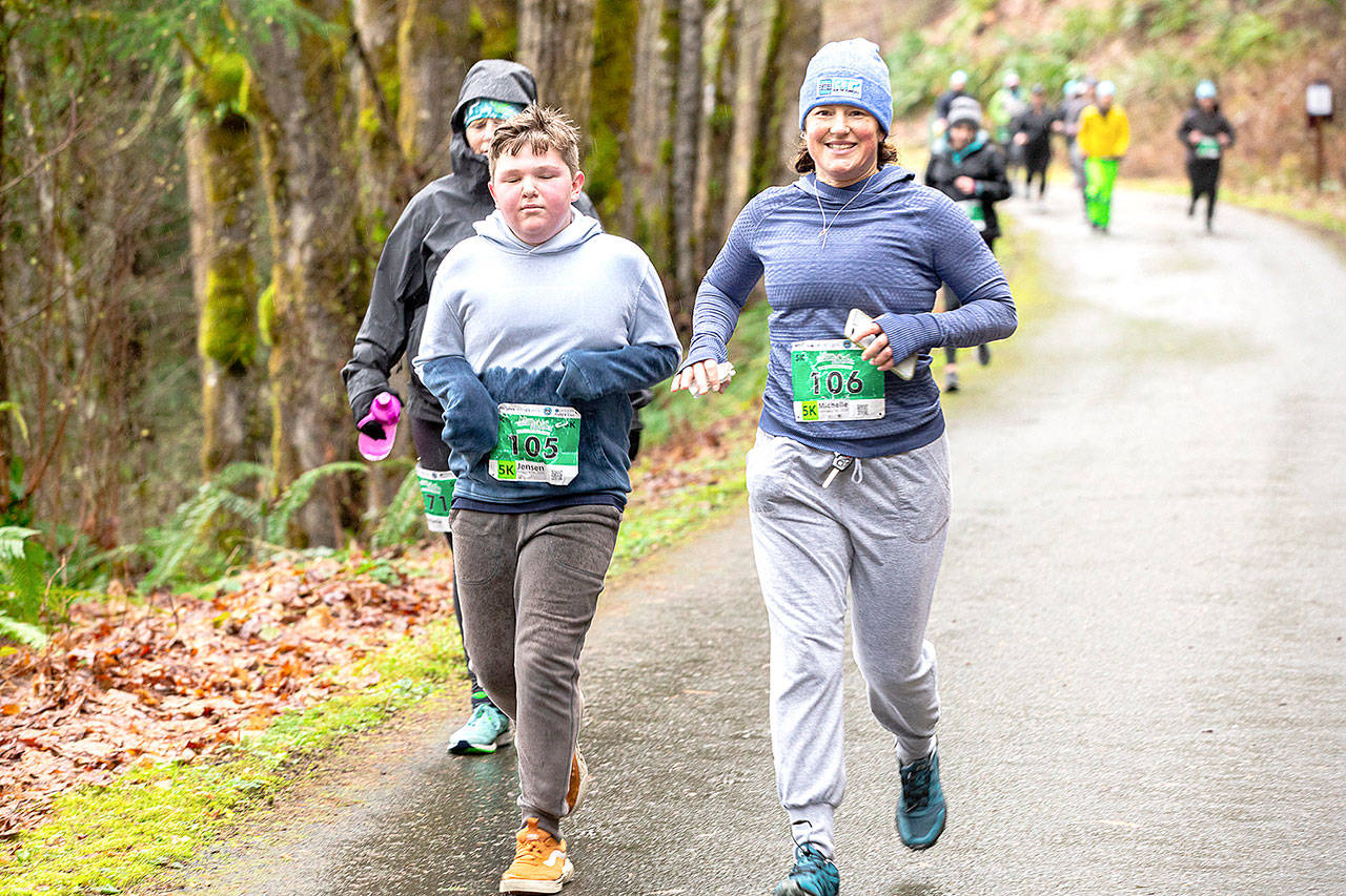 Run the Peninsula Jensen Wolfe, left, and Michelle Turner lead the pack in the 2020 Elwha River Bridge Run. The 2021 race will have a number of COVID-19 precautions, including racers being encouraged to stay 6 feet apart.