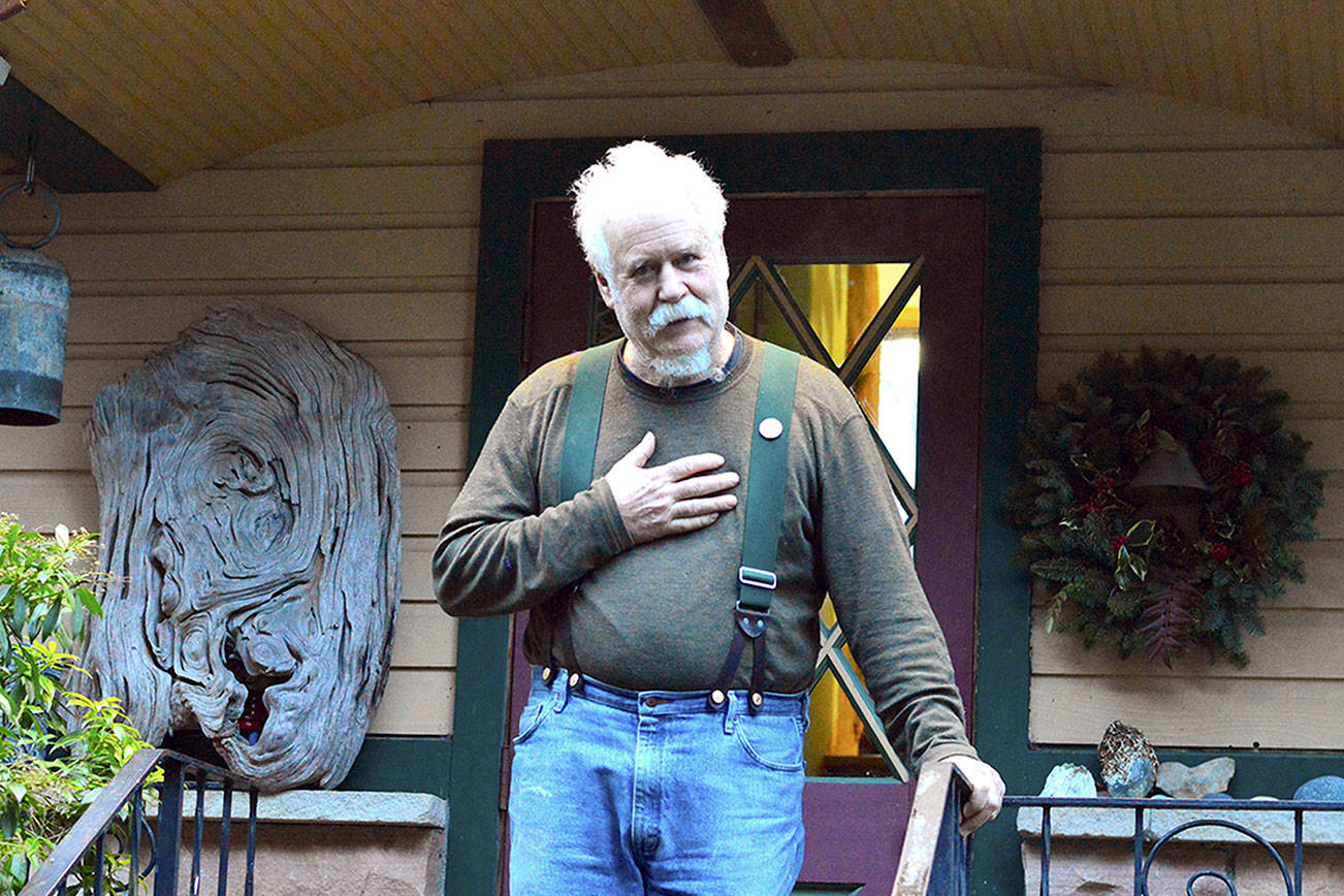 Doug Milholland of Port Townsend invites people to join him in ringing bells, playing instruments and singing at noon Friday in support of the U.N. Treaty on the Prohibition of Nuclear Weapons, which enters into force that day. (Diane Urbani de la Paz/Peninsula Daily News)