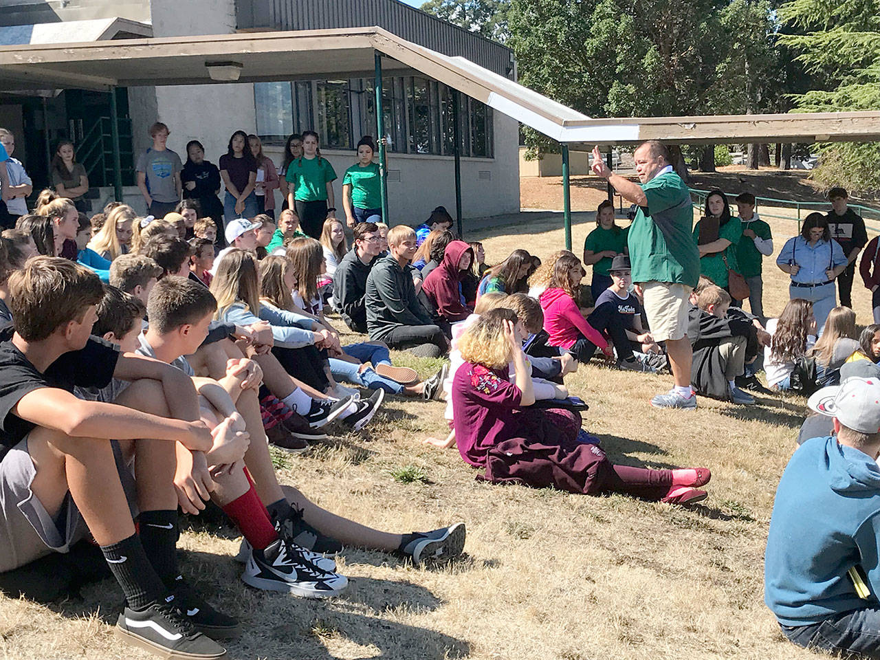 Port Angeles Athletic Director Dwayne Johnson speaks to a group of freshman during a pre-COVID orientation session. Johnson has received the Gareth Giles Memorial Award recognizing him for his leadership and dedication to Washington state students from the Washington Interscholastic Activities Association.
Port Angeles School District
Port Angeles Athletic Director Dwayne Johnson speaks to a group of freshman during a pre-COVID orientation session. Johnson has received the Gareth Giles Memorial Award recognizing him for his leadership and dedication to Washington state students from the Washington Interscholastic Activities Association. (Port Angeles School District)