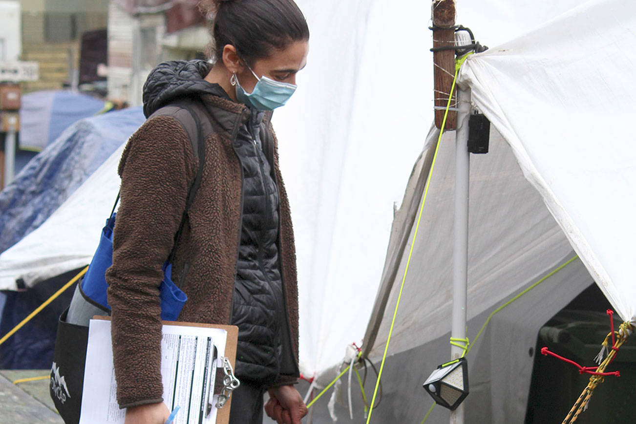 Tirzah Juskalian, COVID Navigator for Olympic Community Action Programs, talks to homeless campers at the Jefferson County Fairgrounds Thursday during the annual Point In Time homeless count. Due to the COVID-19 pandemic, OlyCAP, along with Bayside Housing Services, only used staff to conduct the count, instead of having assistance from volunteers.