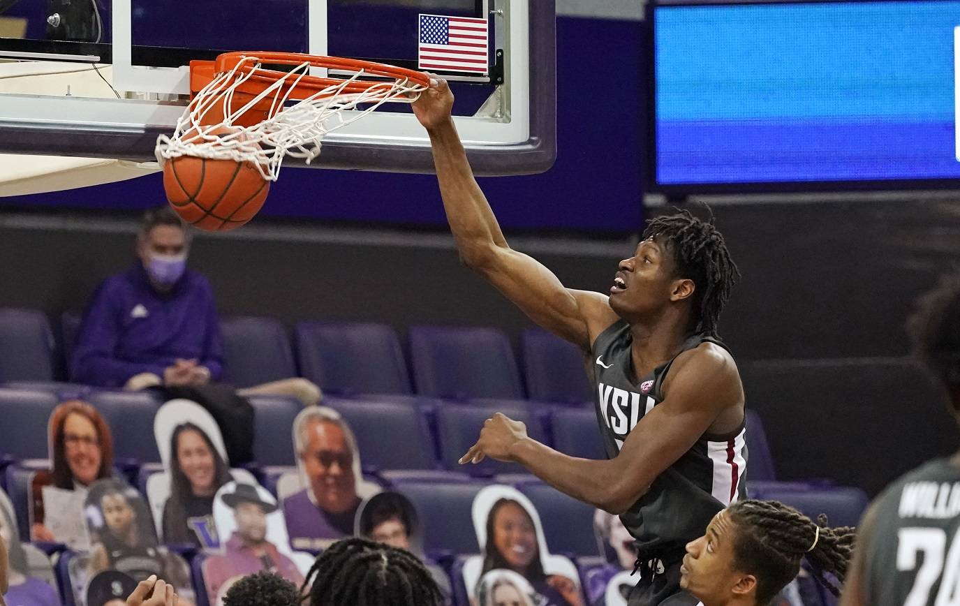 Washington State’s Efe Abogidi dunks against Washington in the first half of an NCAA college basketball game Sunday, Jan. 31, 2021, in Seattle. (AP Photo/Elaine Thompson)