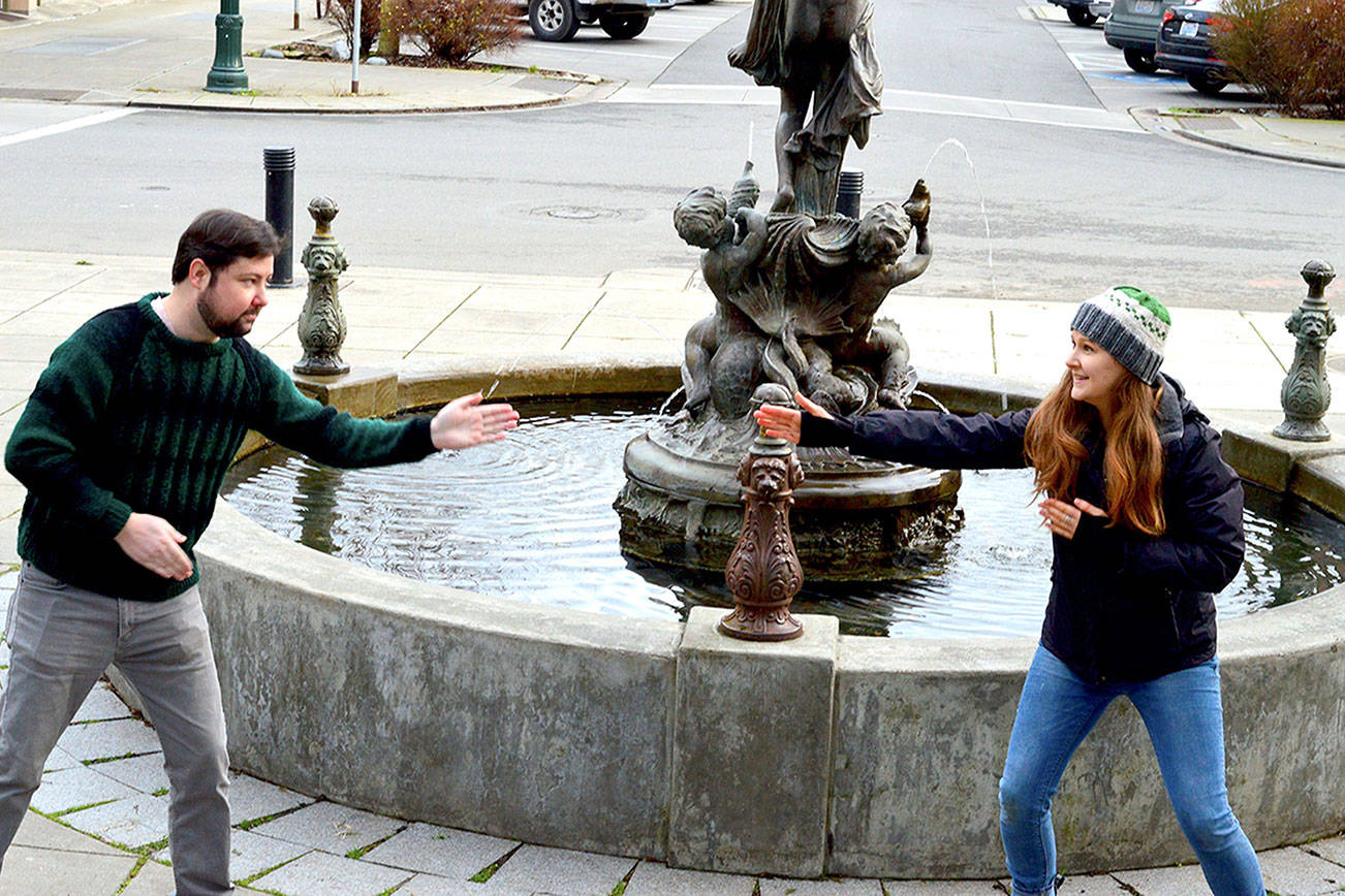 Key City Public Theatre's Brendan Chambers and Maggie Jo Bulkley engage in a little "zip zap zop," a theater game, in preparation for their youth theater classes in Port Townsend. The two are not wearing masks in this photo because they live in the same household. Diane Urbani de la Paz/Peninsula Daily News