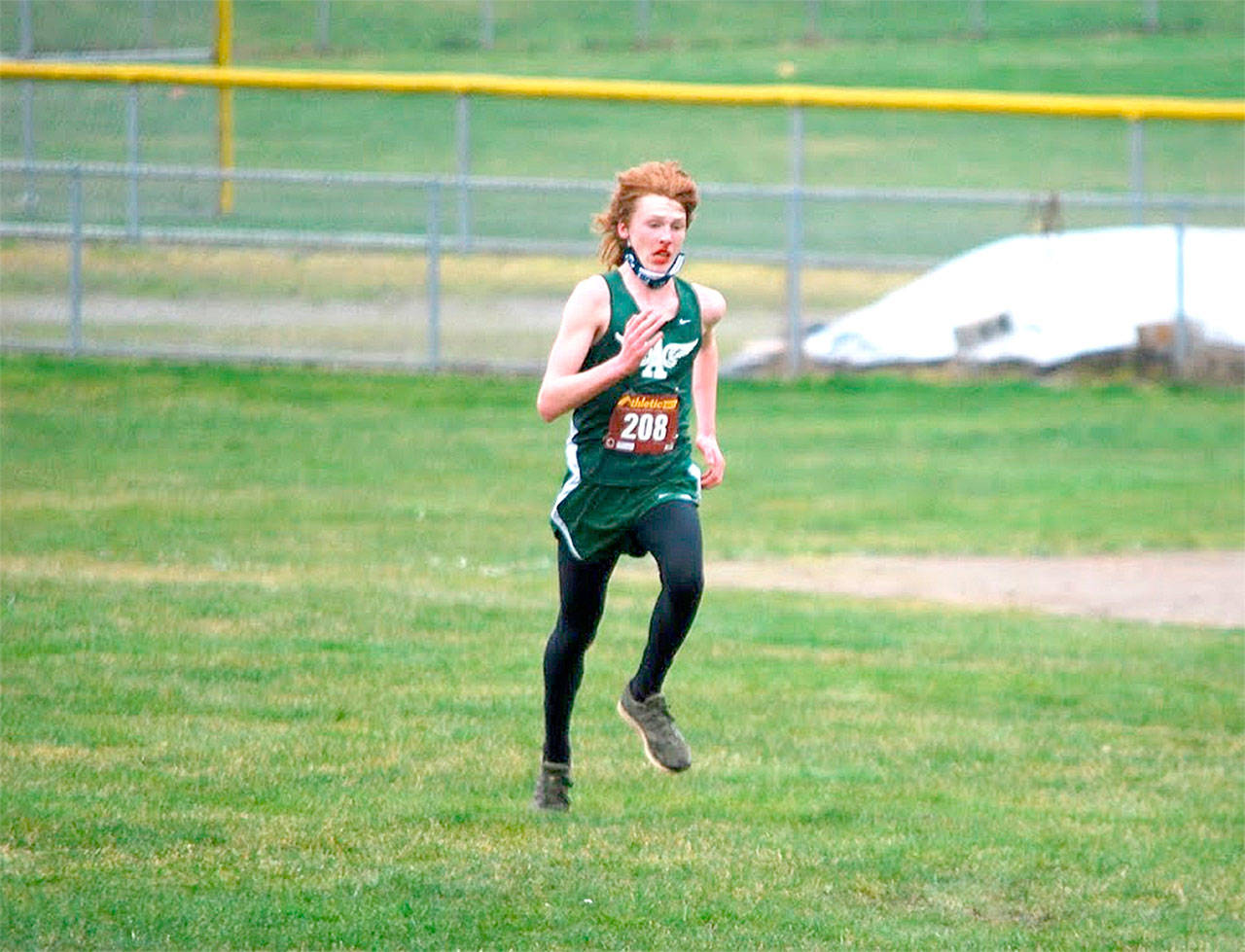 Port Angeles’ Jack Gladfelter races in Saturday’s dual meet again Sequim on Saturday at Kingston. Gladfelter won the boys’ race.