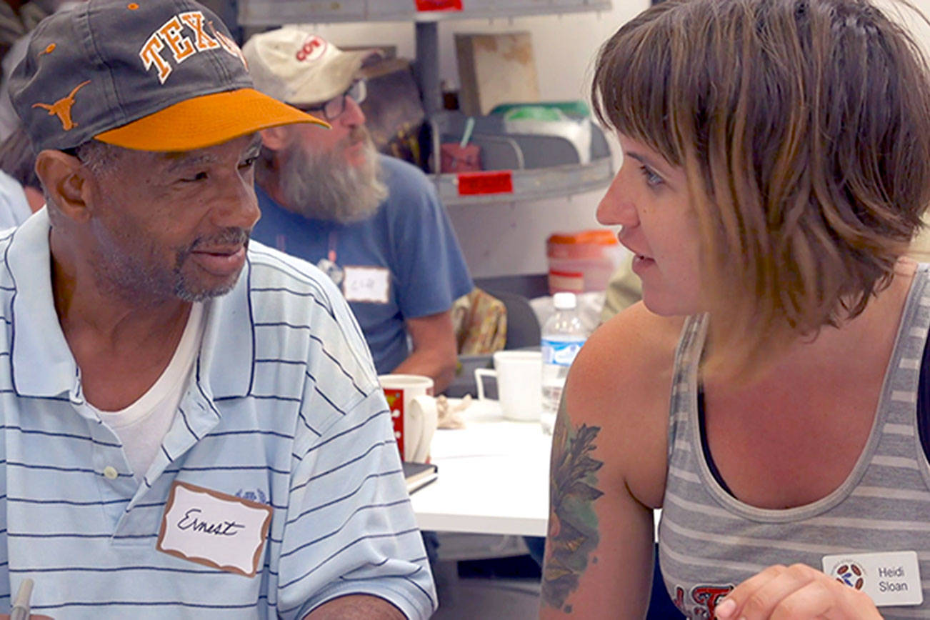 At the Community First! village in Austin, Texas, resident Ernest chats with farmer Heidi Sloan. The village is the subject of a documentary streaming free this week from the Port Townsend Film Festival. photo courtesy Layton Blaylock/Inferno Films