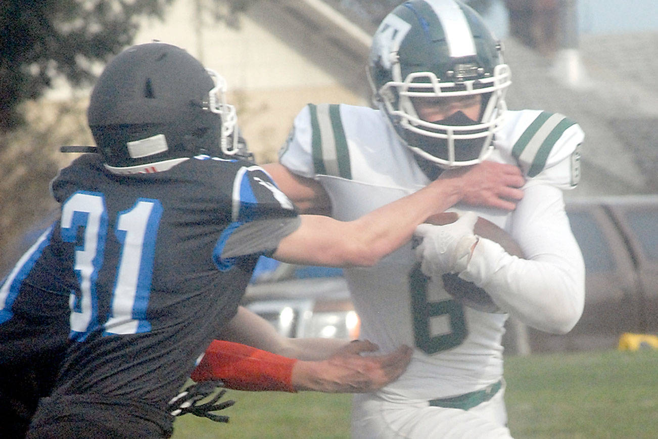 Keith Thorpe/Peninsula Daily News
Port Angeles' Jaziel Livingston, right, tries to slip around the defense of East Jefferson's Nathan Nisbet on Saturday on the Stevens Middle School athletic field in Port Angeles.