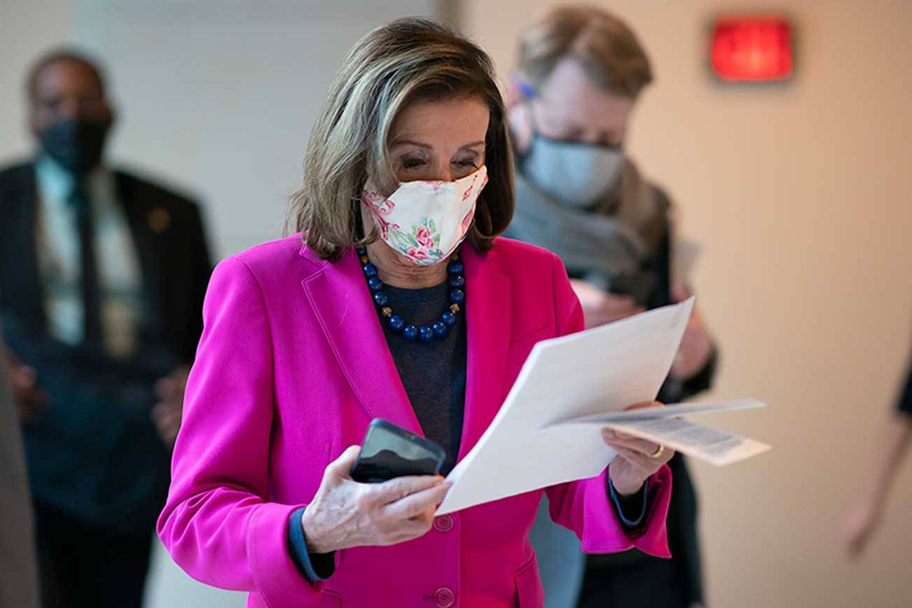 Speaker of the House Nancy Pelosi, D-Calif., walks to a news conference as the Democratic-led House is poised to pass a bill that enshrines protections in the nation's labor and civil rights laws for LGBTQ people, a top priority of President Joe Biden, at the Capitol in Washington, Thursday, Feb. 25, 2021. (J. Scott Applewhite/The Associated Press)