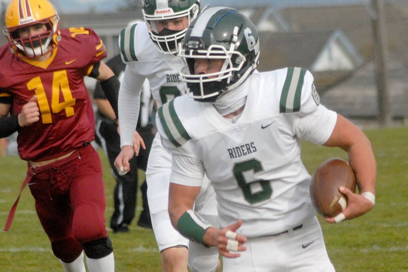 Keith Thorpe/Peninsula Daily News
Port Angeles' Jaziel Livingston rushes for yardage while pursued by Kingston's Lief Nelson, left, and teammate Jake Jacobsen on Saturday at Stevens Middle School.