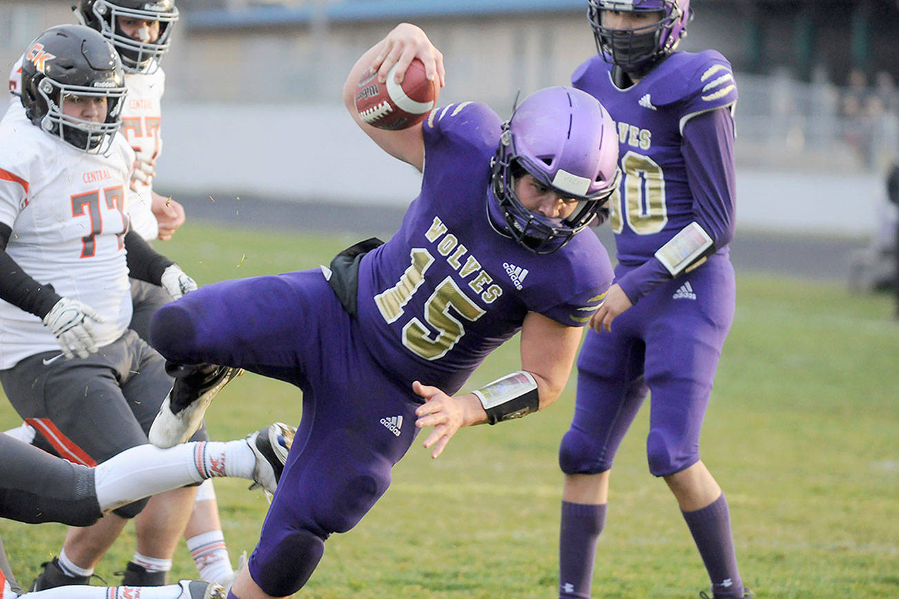 Michael Dashiell/Olympic Peninsula News Group
Sequim's Taig Wiker dives for yardage during the Wolves' 38-22 win over Central Kitsap.