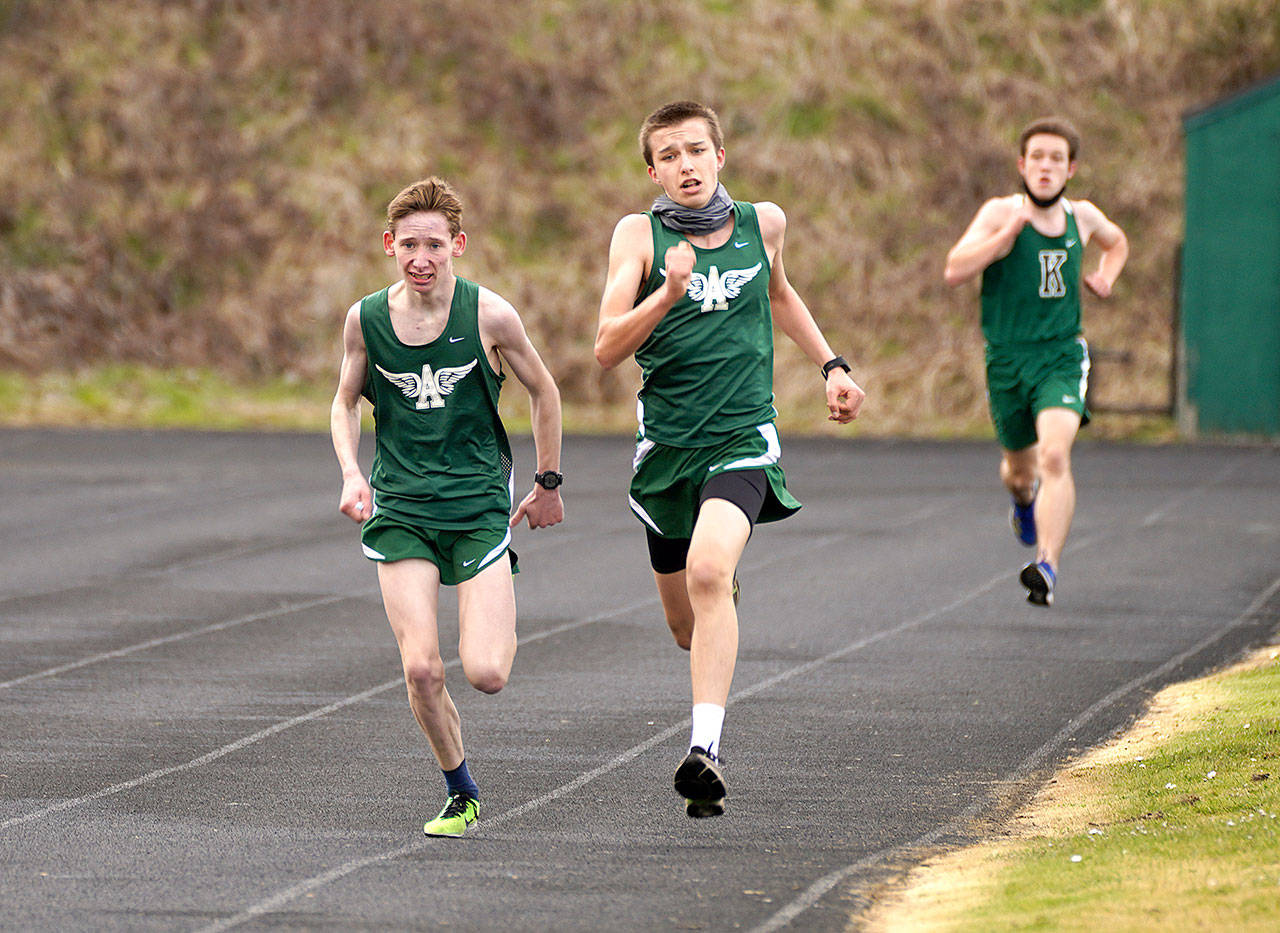 Port Angeles Roughriders finish the 3,000-meter race at the Roughriders track and field jamboree Saturday with Klahowya. From left are Langdon Larson, Port Angeles (10:12.94), Maxwell Baeder, Port Angeles (10:12.85) and Evan Hagle, Klahowya (10:19.75). (Photo courtesy of Loren Larson)