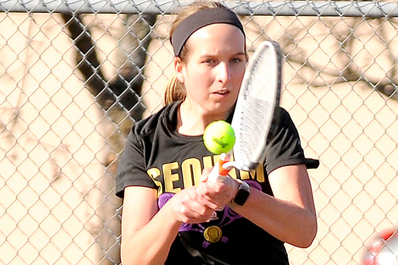 Michael Dashiell/Olympic Peninsula News Group
Sequim's Kalli Wiker, a defending state champion in tennis, hits a volley against North Mason on Monday. Wiker won her match in straight sets.