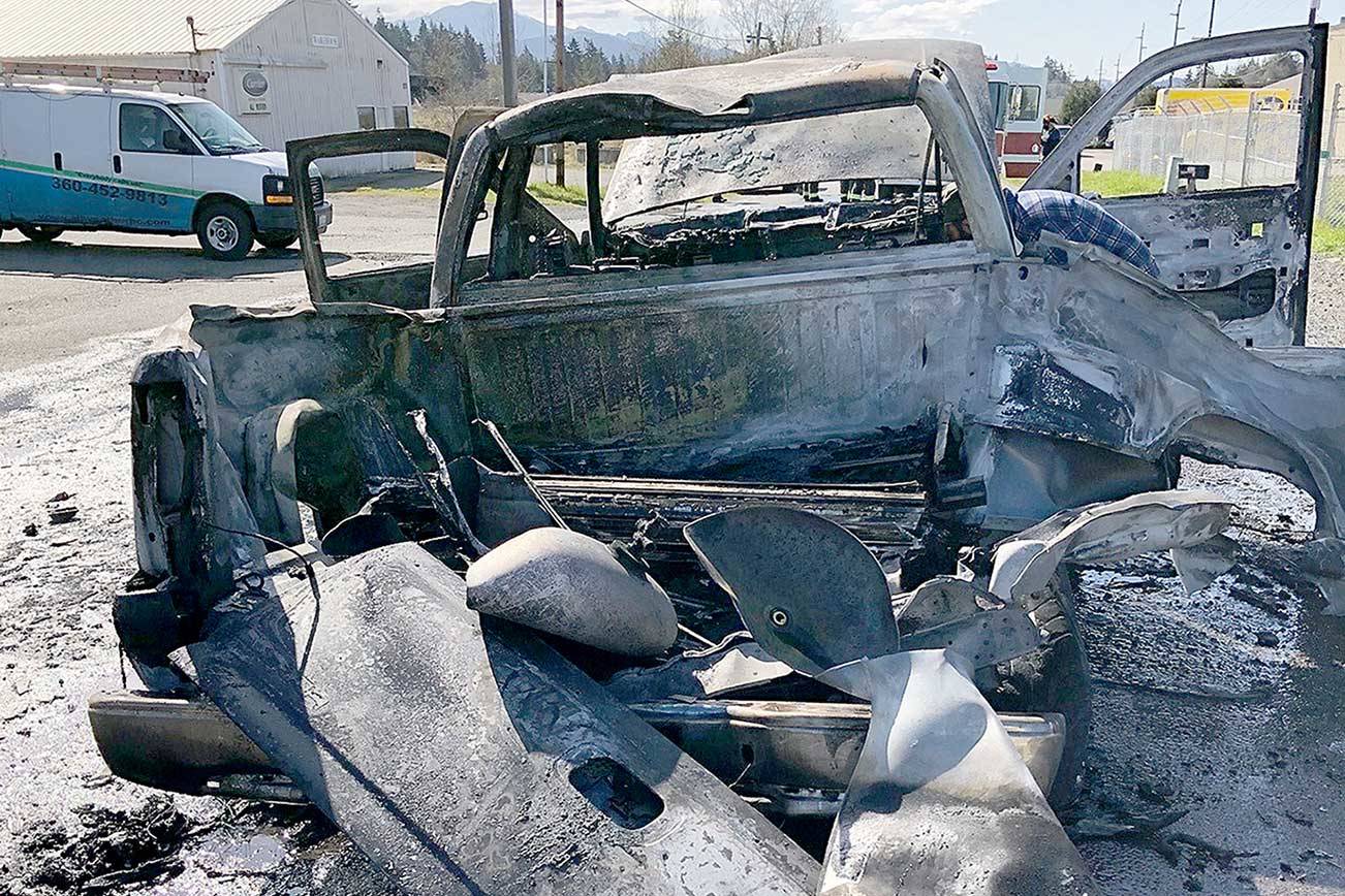 A GMC Sierra burned and two propane tanks exploded on Sunday on Kemp Street behind the IGS grocery store on U.S. Highway 101 east of Port Angeles. (Clallam County Fire District 2)