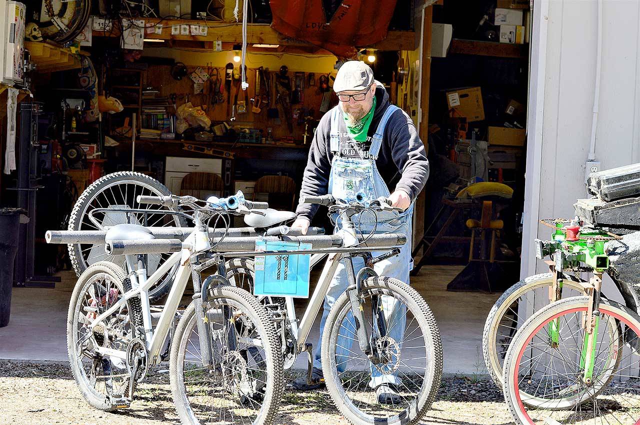 After a long winter, kinetic sculptor Colin Bartle brings his machines out into the Port Townsend sunlight on Sunday. He’s among the builders hoping to join October’s Great Port Townsend Bay Kinetic Sculpture Race. (Diane Urbani de la Paz/Peninsula Daily News)