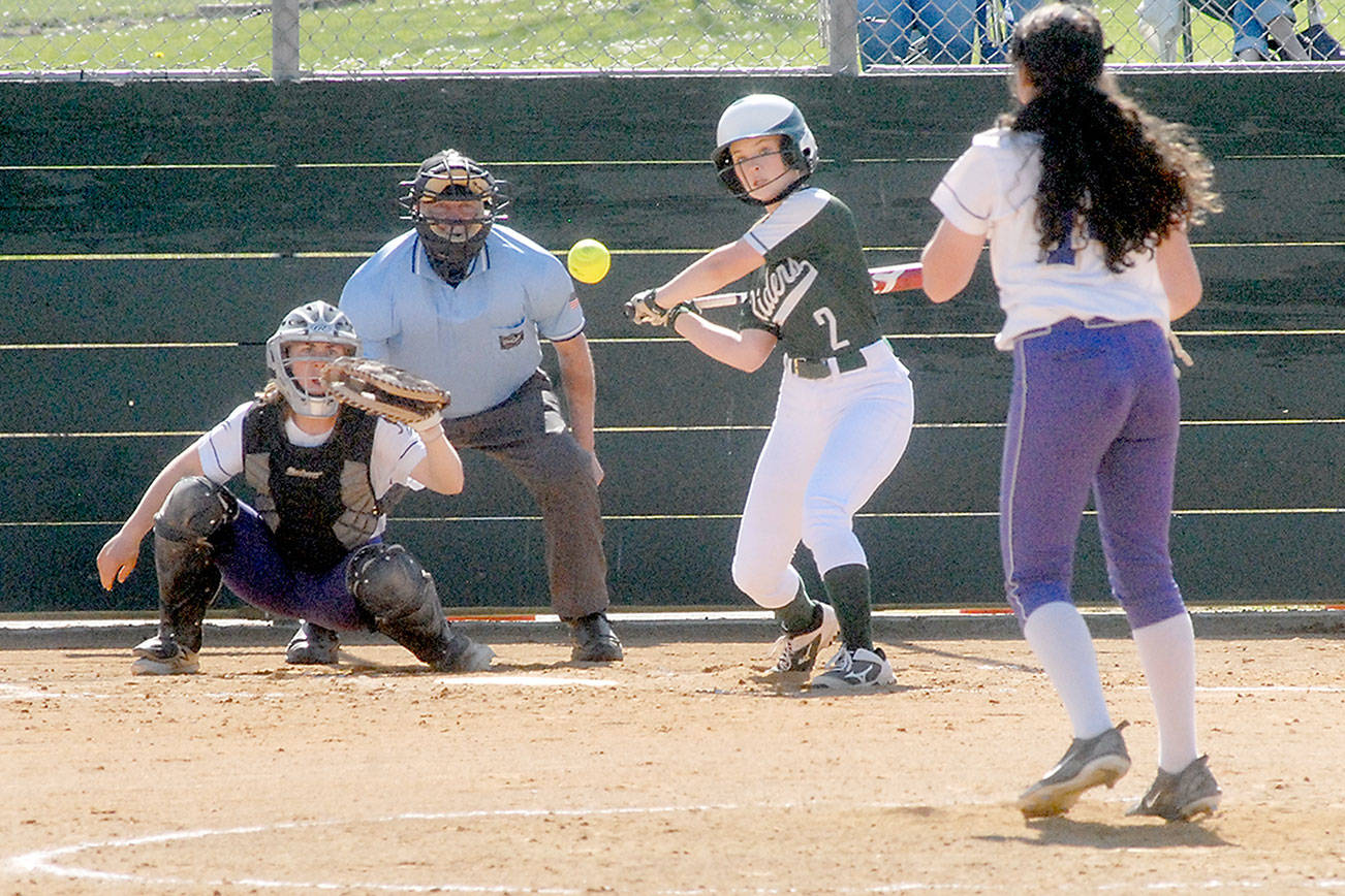 Keith Thorpe/Peninsula Daily News
Port Angeles' Peyton Rudd bats against Sequim pitcher Laina Vig as catcher Christy Grubb waits for the ball in the second inning on Saturday in Port Angeles.