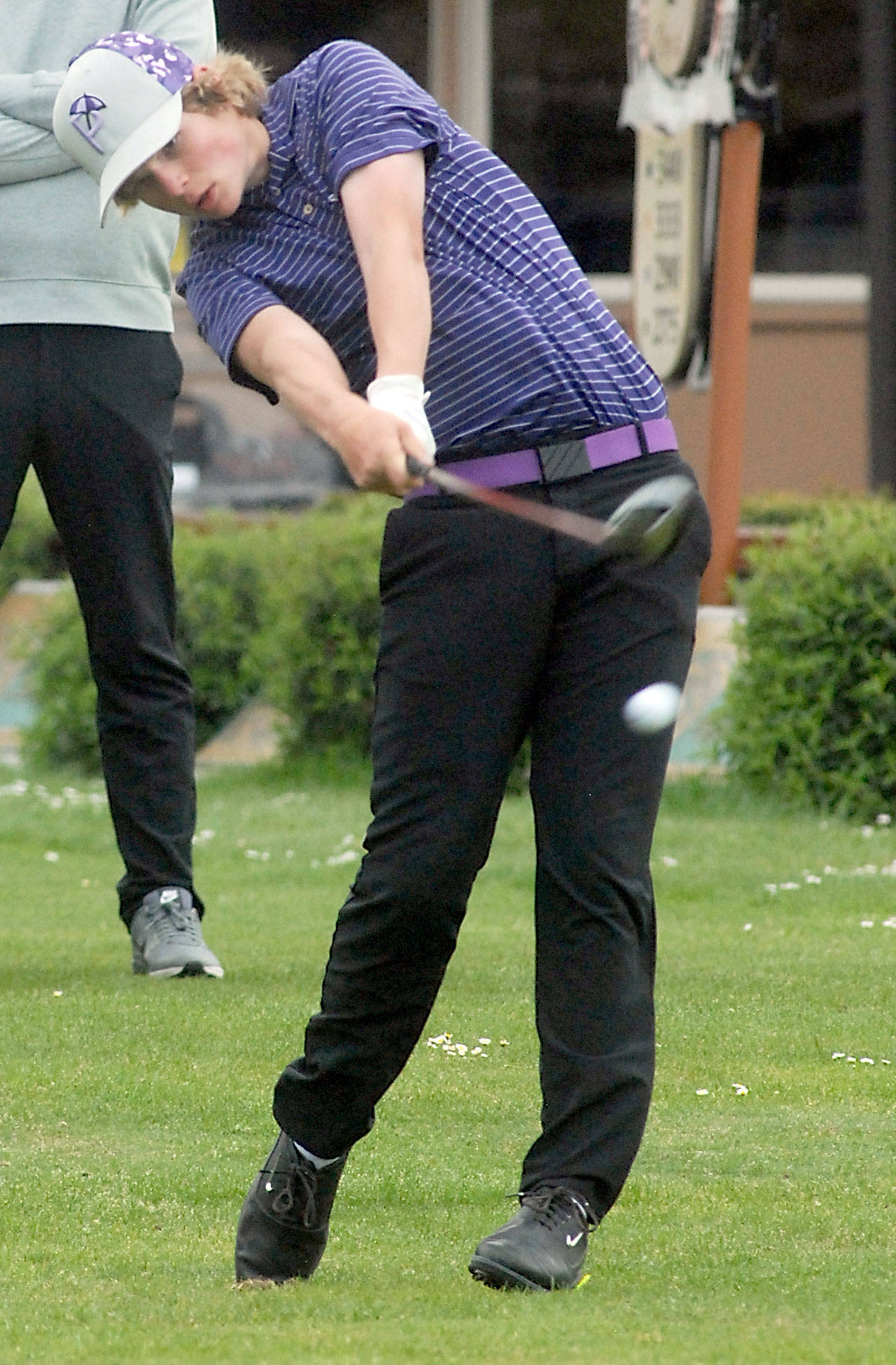 Sequim’s Ben Sweet tees off at the opening of Tuesday’s league championships on his home course at The Cedars at Dungeness. (Keith Thorpe/Peninsula Daily News)