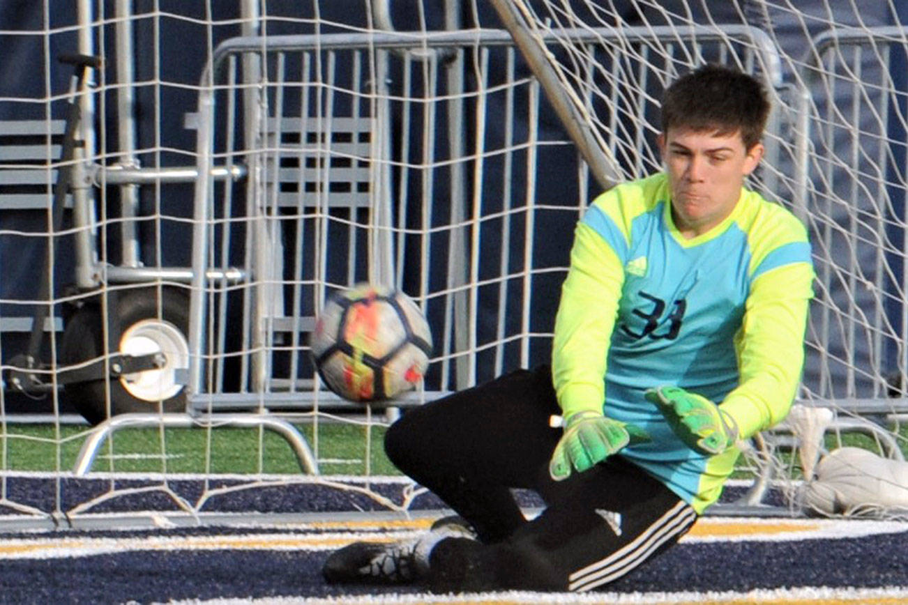 Lonnie Archibald/for Peninsula Daily News
Forks goalkeeper Rafael Terrones saved a La Center penalty kick in the closing minutes to preserve the Spartans' 3-2 win over the Wildcats in the district semifinals.