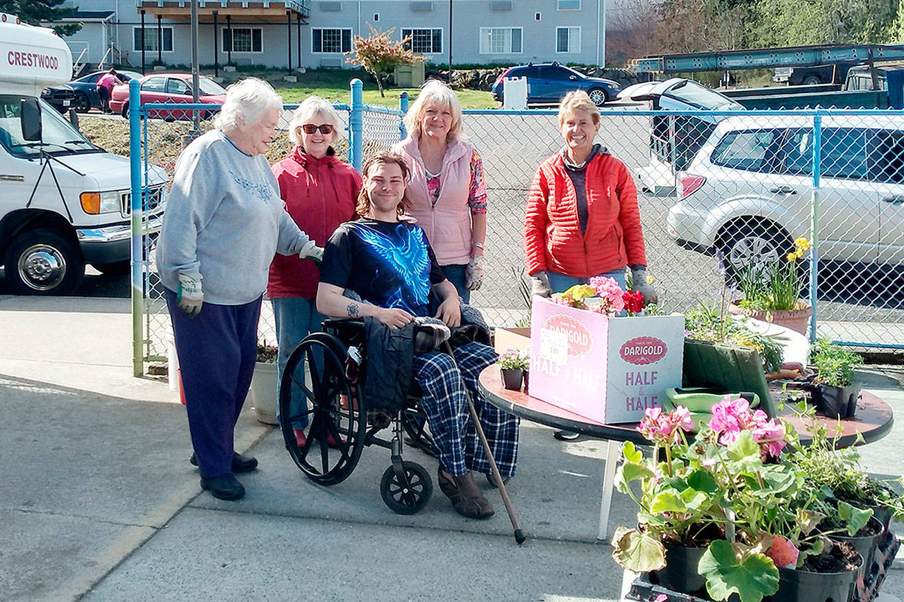 Members of the Port Angeles Garden Club recently gathered for a planting party at Crestwood Health and Rehabilitation. 

Club members added spring blooms to planters on the residents’ patio. 

Pictured standing, from left to right, are Bernice Cook, Kitty Gross, Shari Bley and Mary Kelsoe. 

Seated is Crestwood resident Troy Nicholaysen, who will will care for the plantings.