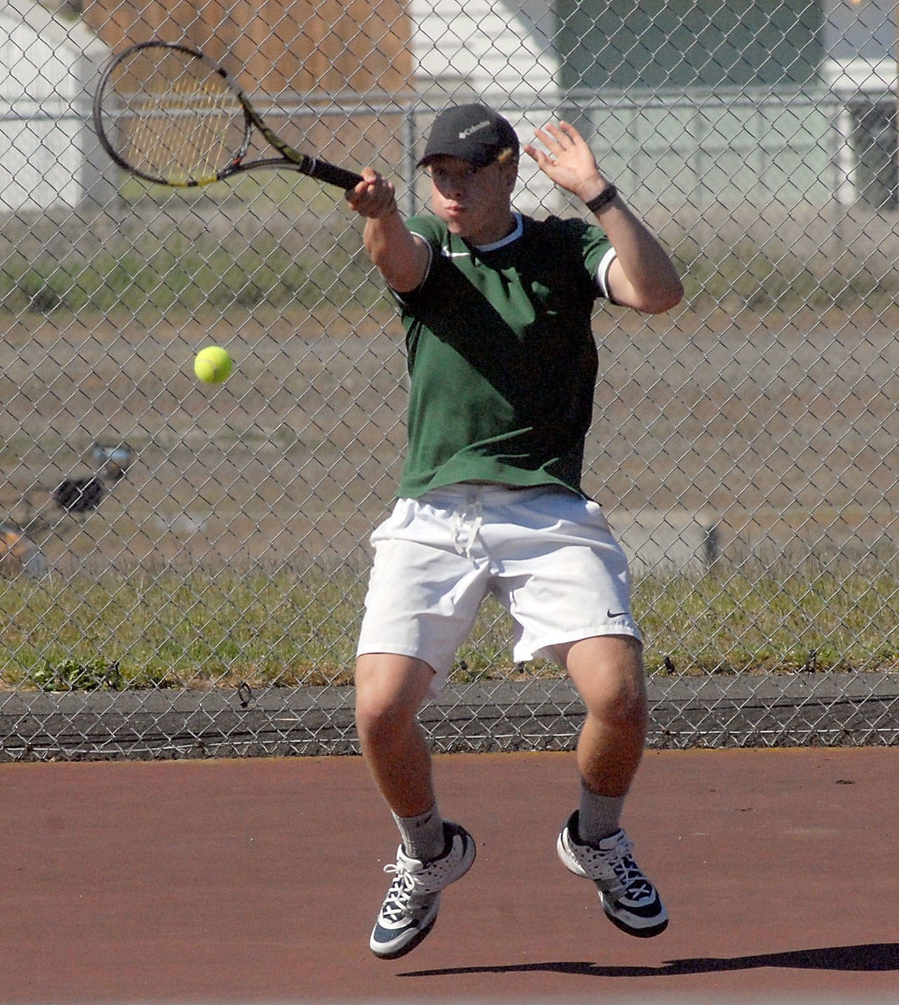 Keith Thorpe/Peninsula Daily News Port Angeles’ Reef Gelder returns the ball in his singles match against East Jefferson’s Carter Cameron on Thursday at Port Angeles High School.