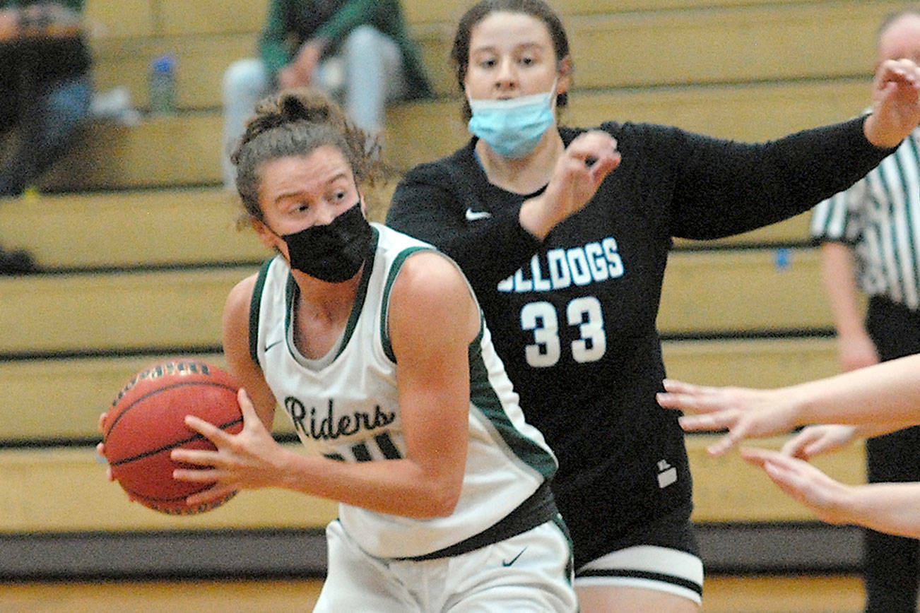 Keith Thorpe/Peninsula Daily News
Port Angeles' Jaida Wood, front, makes her way around North Mason's Mandy Cole in the first quarter of Friday night's game in Port Angeles.