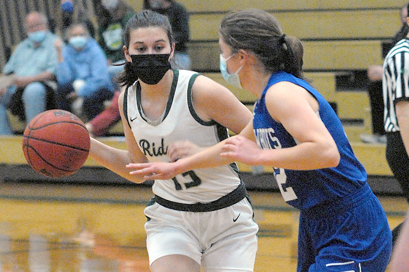 Keith Thorpe/Peninsula Daily News
Port Angeles' Bailee Larson, left, prepares to pass around the defense of East Jefferson's Aurin Asbell on Tuesday night at Port Angeles High School.