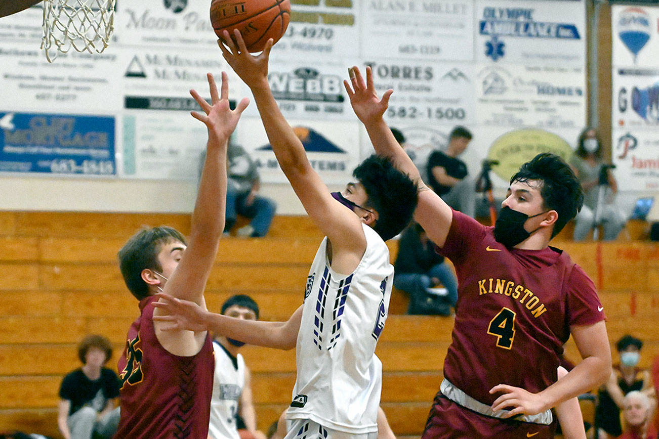 Michael Dashiell/Olympic Peninsula News Group Sequim guard Kristian Mingoy drives to the basket for a score in the first half of Sequim's 64-51 loss to Kingston.