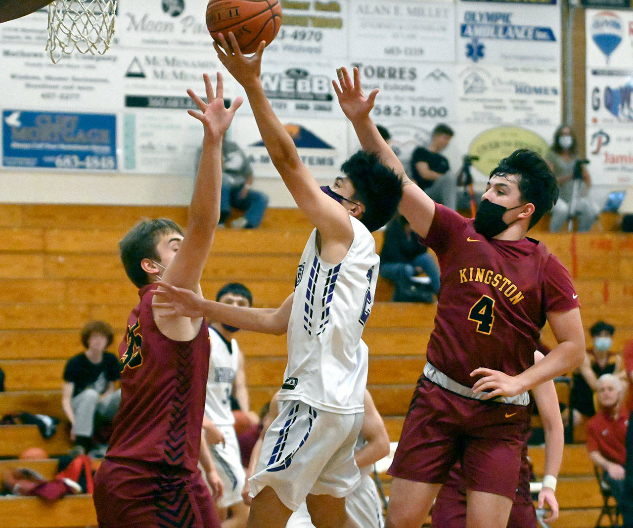 Sequim guard Kristian Mingoy drives to the basket for a score in the first half of Sequim’s 64-51 loss to Kingston. (Michael Dashiell/Olympic Peninsula News Group)