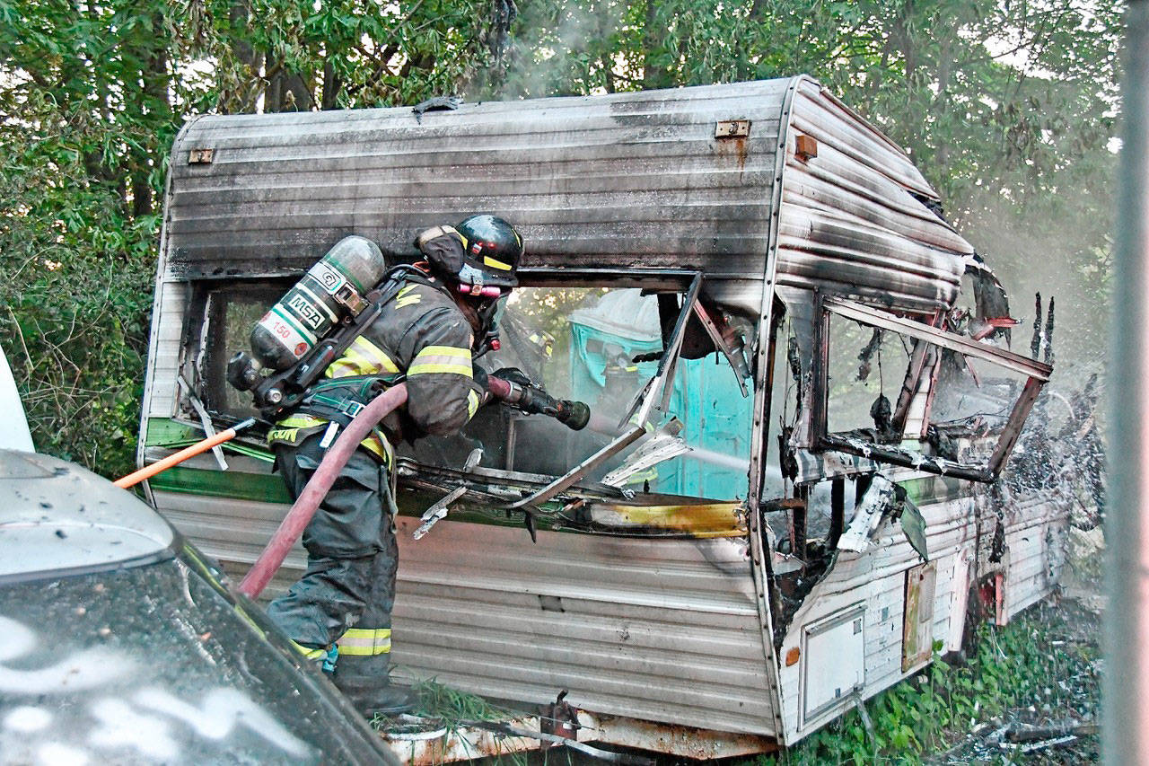 An unoccupied 18-foot travel trailer in Gales Addition east of Port Angeles that was gutted by an early Wednesday evening fire was extinguished by Clallam County Fire District 2 first responders. Fire Chief Jake Patterson said the owner or an occupant of the East Ennis Creek Road parcel could not be contacted and that the blaze is not under investigation. The owner is a Seattle resident. (Clallam County Fire District 2)