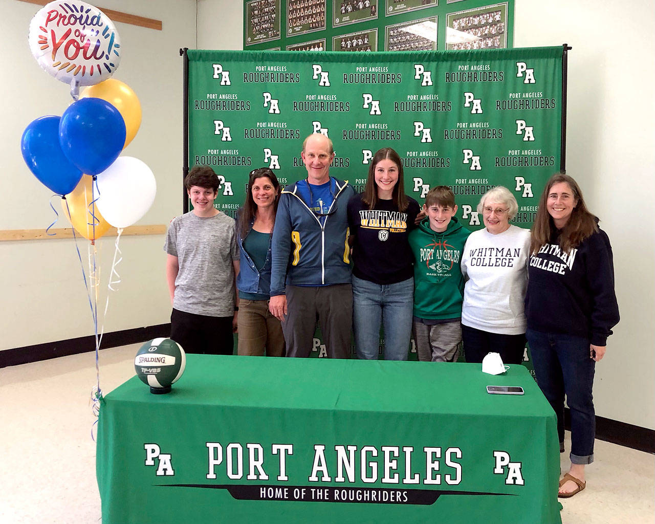 Port Angeles senior Ava Brenkman, fourth from left, signed a letter of intent as an invited walk-on to play college volleyball for Whitman College in Walla Walla. Brenkman was joined by family members, including her dad Sam Brenkman, third from left, and mom Katie Marks, far right.