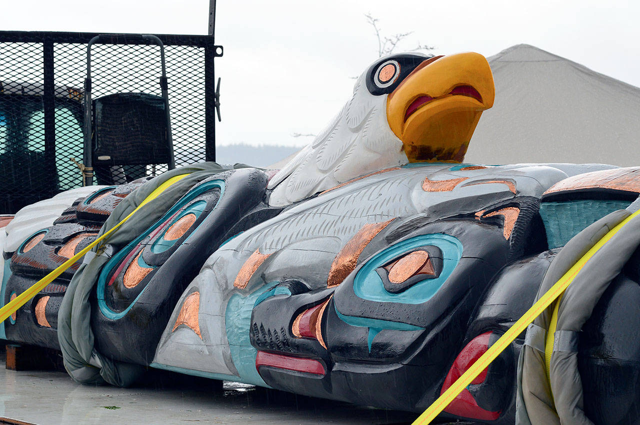 The Lummi totem pole’s symbols of leadership include an eagle, two salmon, a wolf and a bear. The pole arrived in downtown Port Townsend on April 24. The totem pole will visit Port Angeles, Lake Crescent and the Makah Nation on Tuesday. (Diane Urbani de la Paz/Peninsula Daily News)