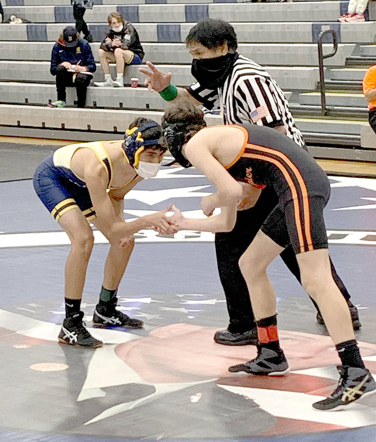 Jesus Garcia-Dominquez of Forks, left, wrestles against a Rainier opponent at the Sgt. Justin Norton Memorial Wrestling Tournament in Rainier on Saturday. Garcia-Dominguez won his 113-pound weight class and the Spartans won the meet as a team. (Photo courtesy of Forks wrestling)