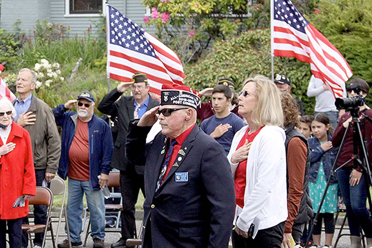 About 70 people assembled for a memorial service in front of the Captain Joseph House in Port Angeles. Sunday marked the 10-year anniversary of the deaths of three servicemen in Afghanistan, including Staff Sgt. Martin R. Apolinar, Sgt. Aaron J. Blasjo and Capt. Joseph W. Schultz. (Dave Logan/for Peninsula Daily News)