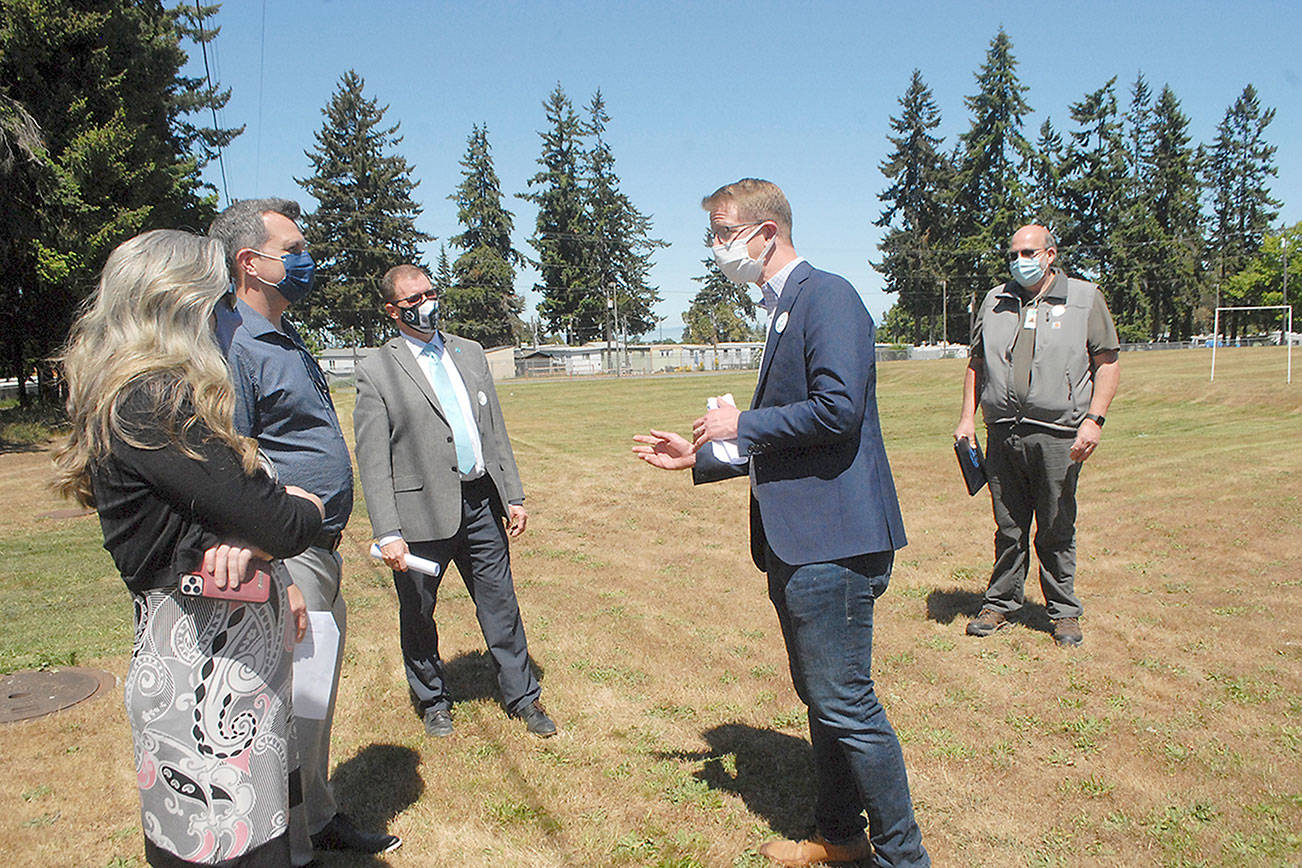 Keith Thorpe/Peninsula Daily News
U.S. Rep. Derek Kilmer, center, speaks to, from left, Port Angeles School Board President Sarah Methner, Port Angeles City Councilman Mike French, School Superintendent Martin Brewer and  school district Maintenance and Facilities Director Nolan Duce during a visit to Monroe Fields.