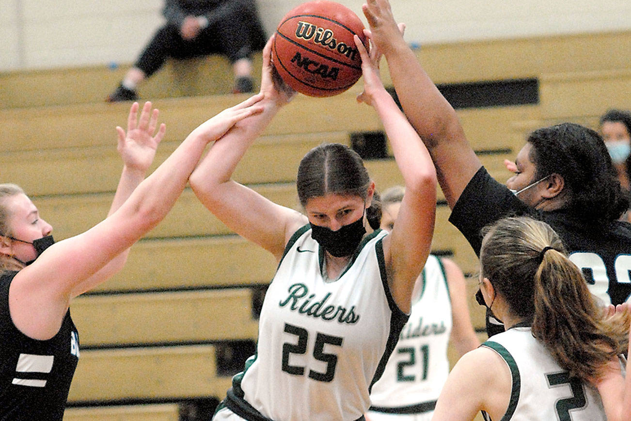 Keith Thorpe/Peninsula Daily News
Port Angeles' Ava Brenkman, center, fends of the defense of North Mason's Tessa Griffey, left, and Tanza Tupolo, right, as Burke's teammate, Bergen Shamp, tries to assist on Saturday in Port Angeles.