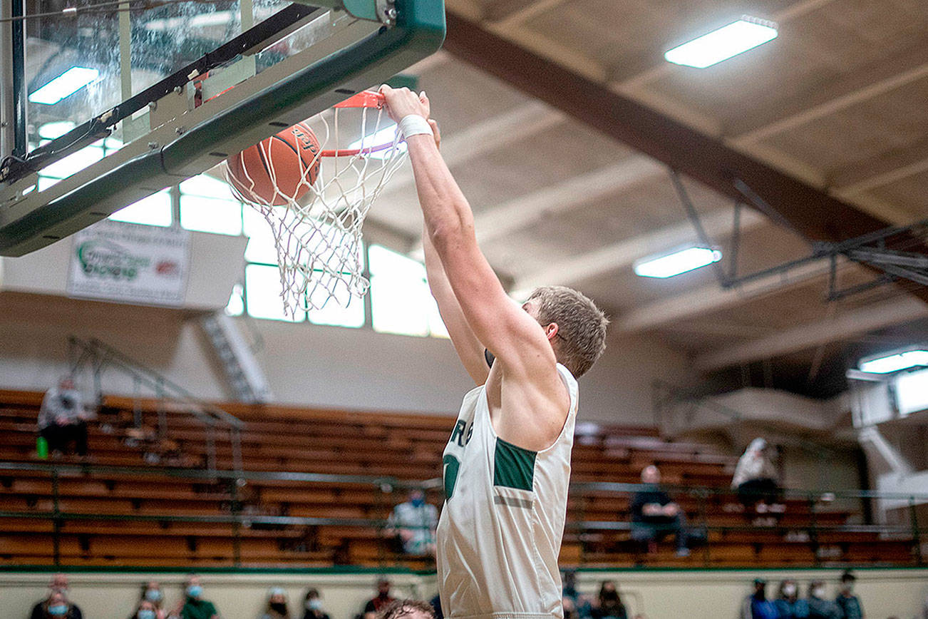 Jesse Major/for Peninsula Daily News
The Roughriders' John Vaara dunks the ball for two of his points against Central Kitsap on Monday in Port Angeles.