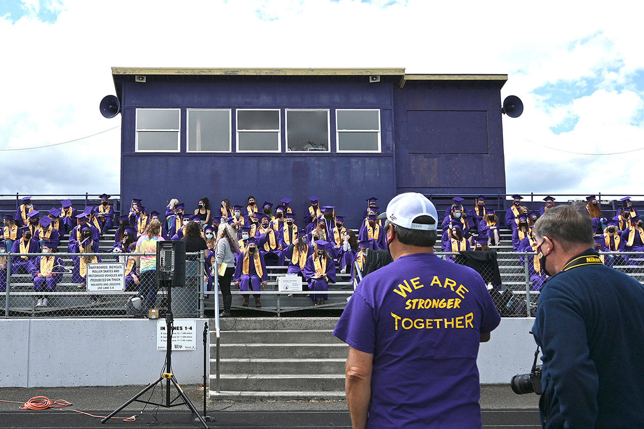 Sequim High School principal Shawn Langston (foreground, left) and photography teacher Jim Heintz look on at an SHS graduation rehearsal on Jan 9. An estimated 187 seniors will graduate at the school’s commencement ceremony on Friday. (Michael Dashiell/Olympic Peninsula News Group)