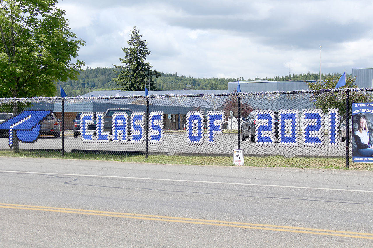 Chimacum School District has lined the fence outside of the school along Rhody Drive with banners honoring its 2021 graduating class. Public high schools across the North Olympic Peninsula are conducting their graduation ceremonies this weekend. (Zach Jablonski/Peninsula Daily News)