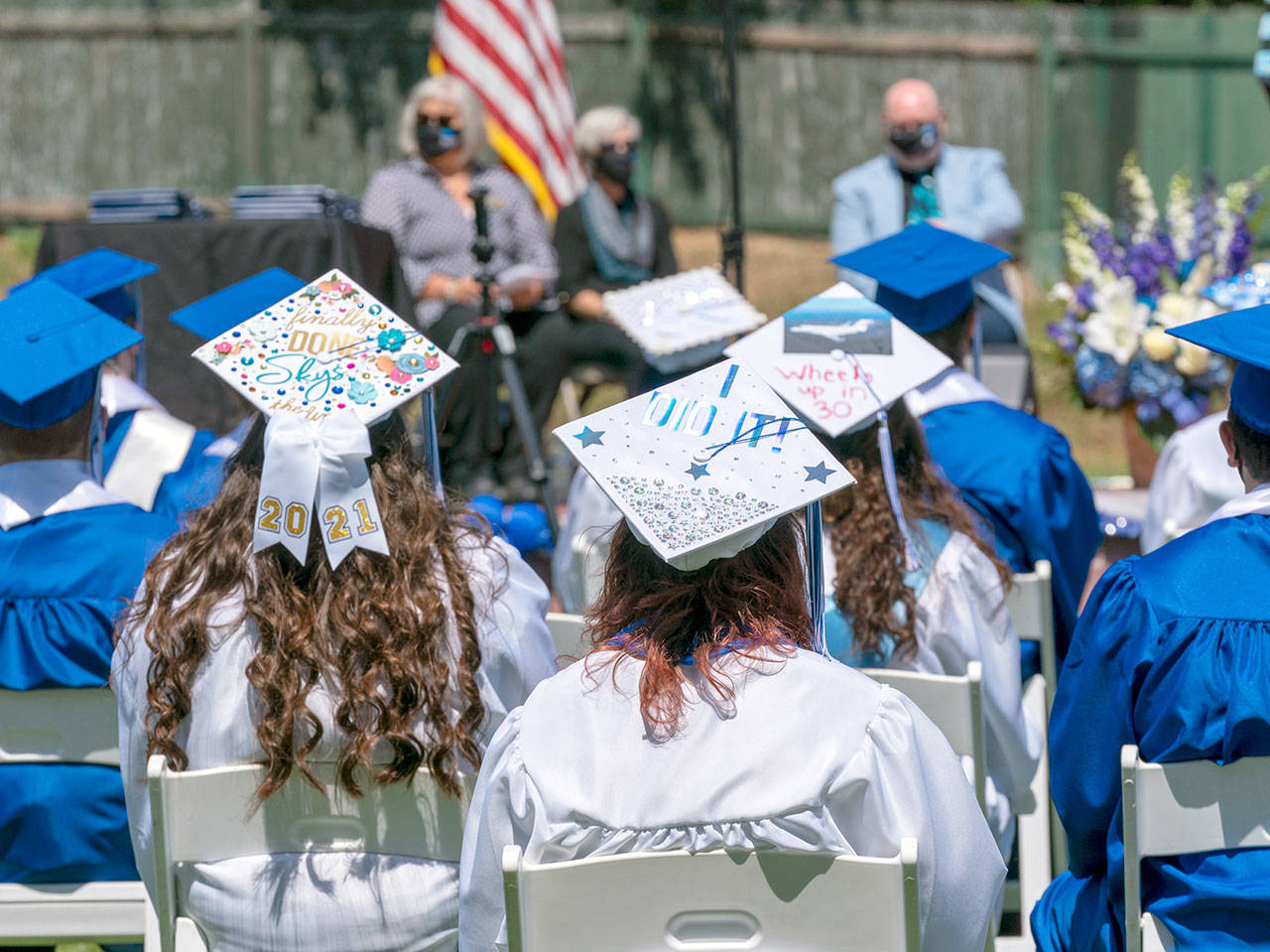 Chimacum graduating seniors display their creative side with mortar board art display during a commencement ceremony at Memorial Field in Port Townsend on Saturday. (Steve Mullensky/for Peninsula Daily News)