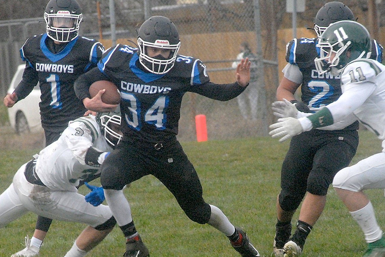 Keith Thorpe/Peninsula Daily News
Logan Massie of East Jefferson is surrounded by Port Angeles' Kameron Meadows, left, and Jacob Felton, right, as Massie is backed up by teammates Hunter Cerna, left rear and Anton Jones during a February game in Port Angeles. East Jefferson is looking for a new head coach after the resignation of Patrick Gaffney.